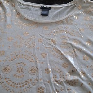 ladies cream color tee with gold